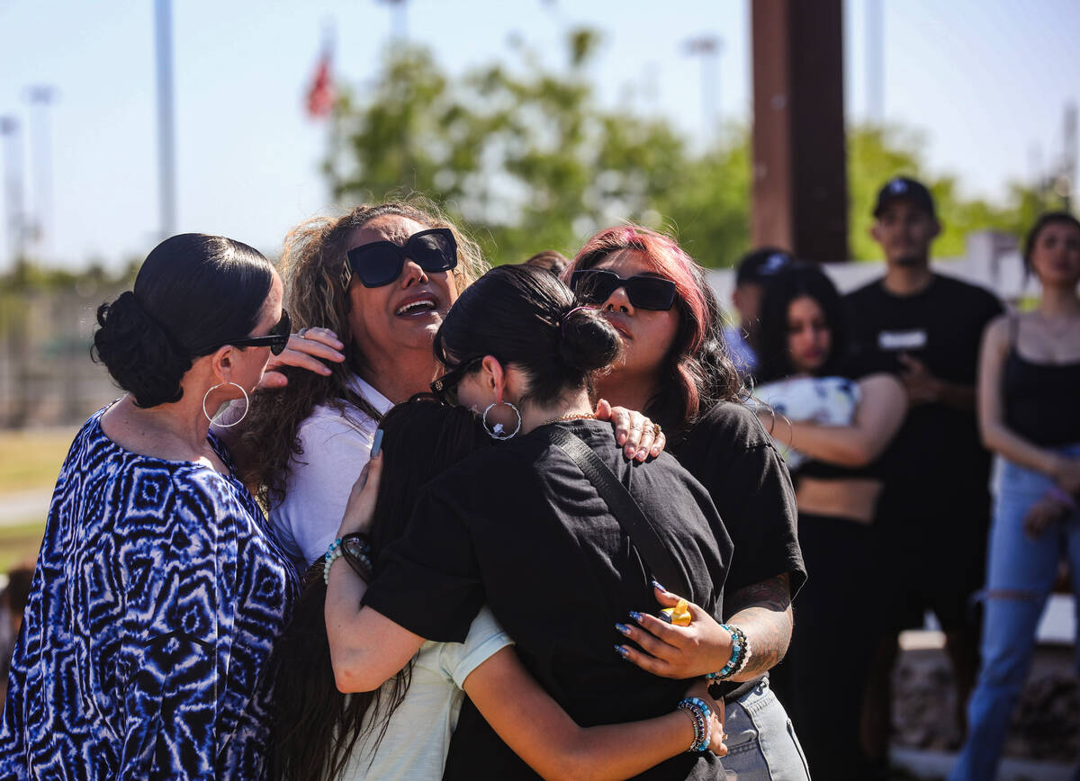 Regina Lacerda, mother of Tabatha Tozzi, is embraced by friends as she cries out after releasin ...