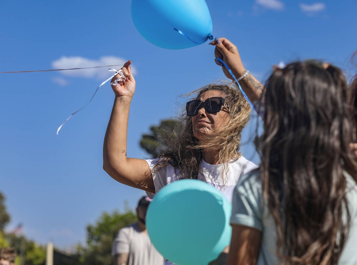 Regina Lacerda, mother of Tabatha Tozzi, releases a balloon in honor of her daughter at a celeb ...