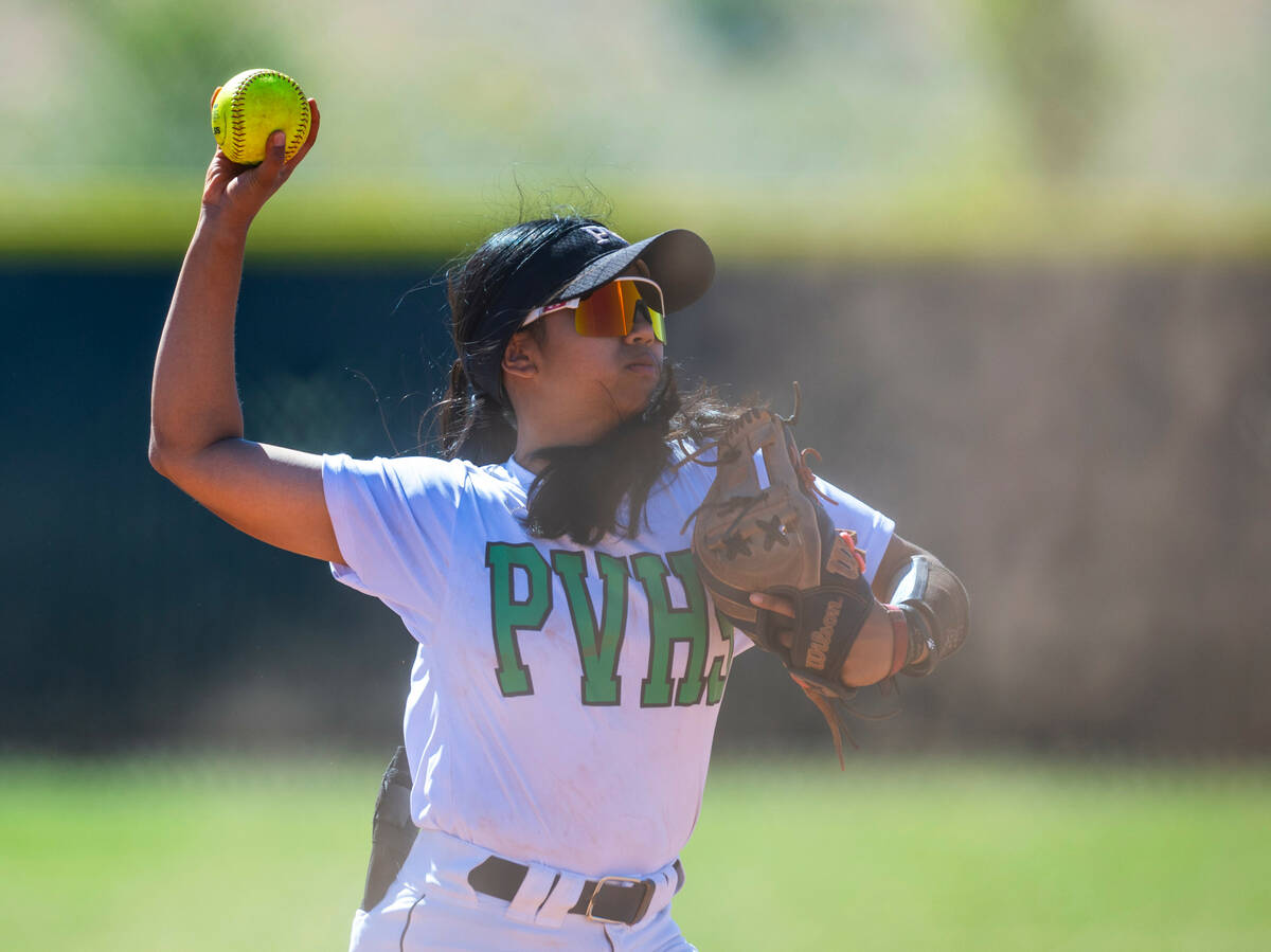 Palo Verde infielder Kayleen Enriquez (6) eyes a throw to first base and a Centennial runner du ...