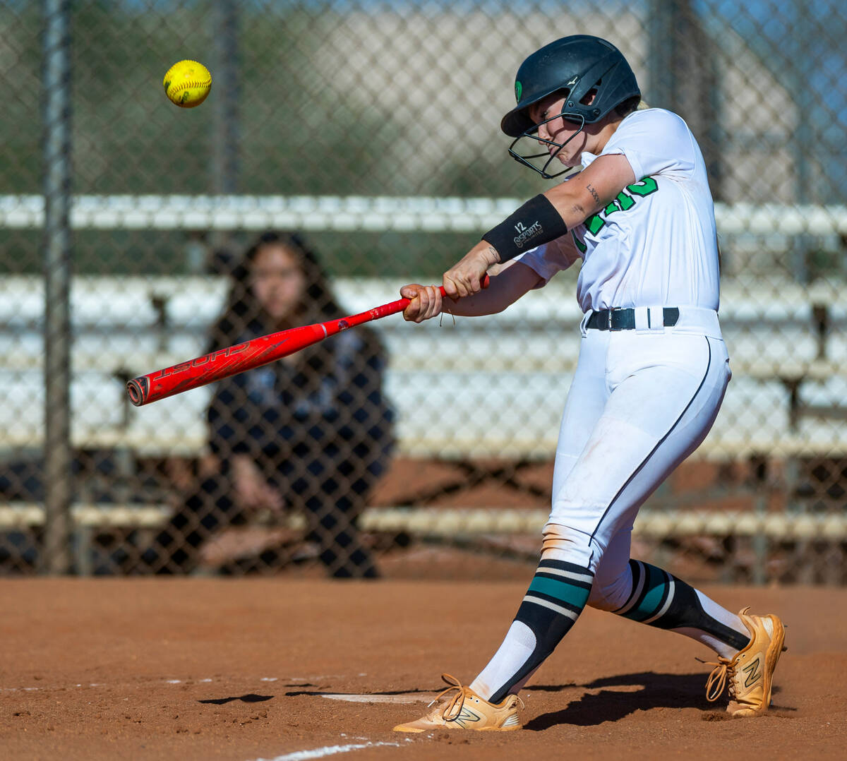 Palo Verde batter Paige Brandes (12) connects on a pitch by Centennial during the third inning ...