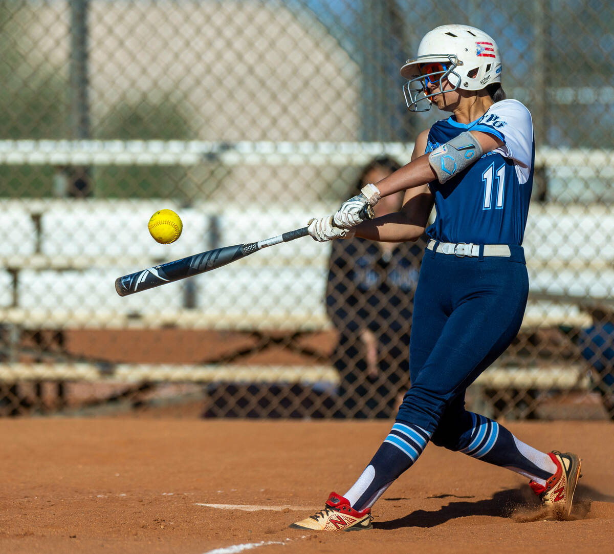 Centennial batter Andrea Campos-Colon (11) connects on a pitch from Palo Verde during the fifth ...