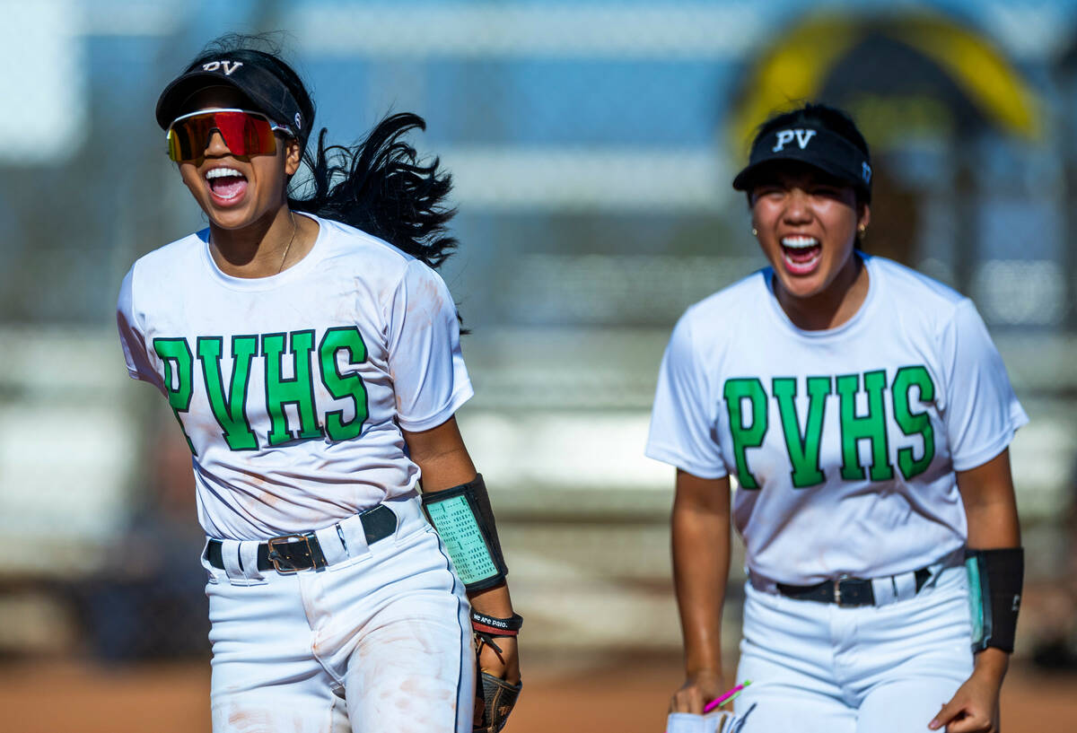 Palo Verde's Kayleen Enriquez (6) and Makayla Enriquez (17) are excited by a run-saving catch i ...