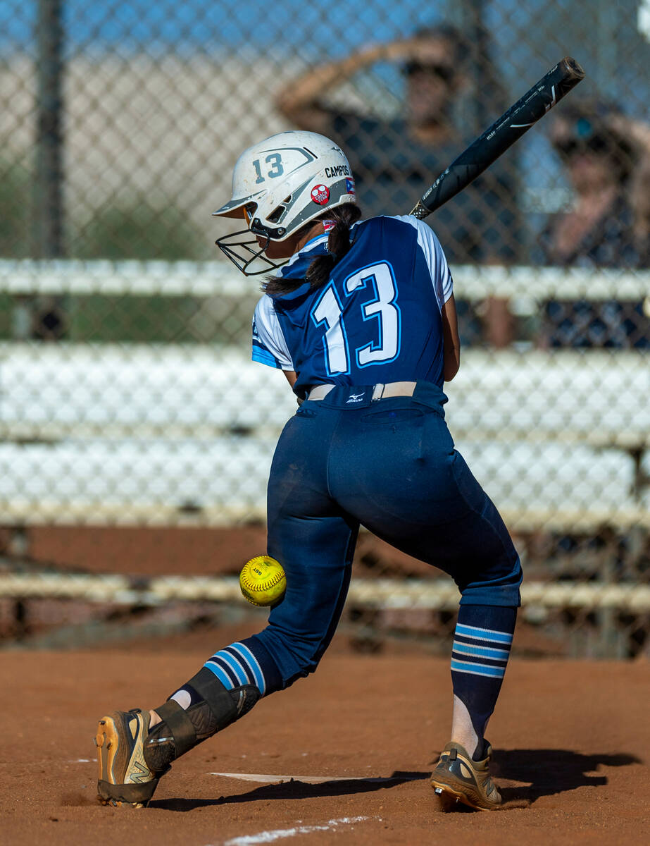 Centennial batter Amanda Campos-Colon (13) is hit by a Palo Verde pitch during the sixth inning ...