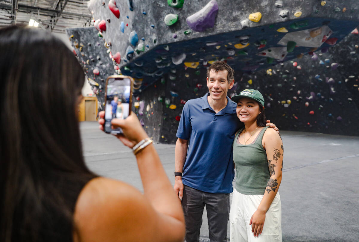 Drianna Dimatulac has her photo taken with Alex Honnold, a revered rock climber known for his f ...