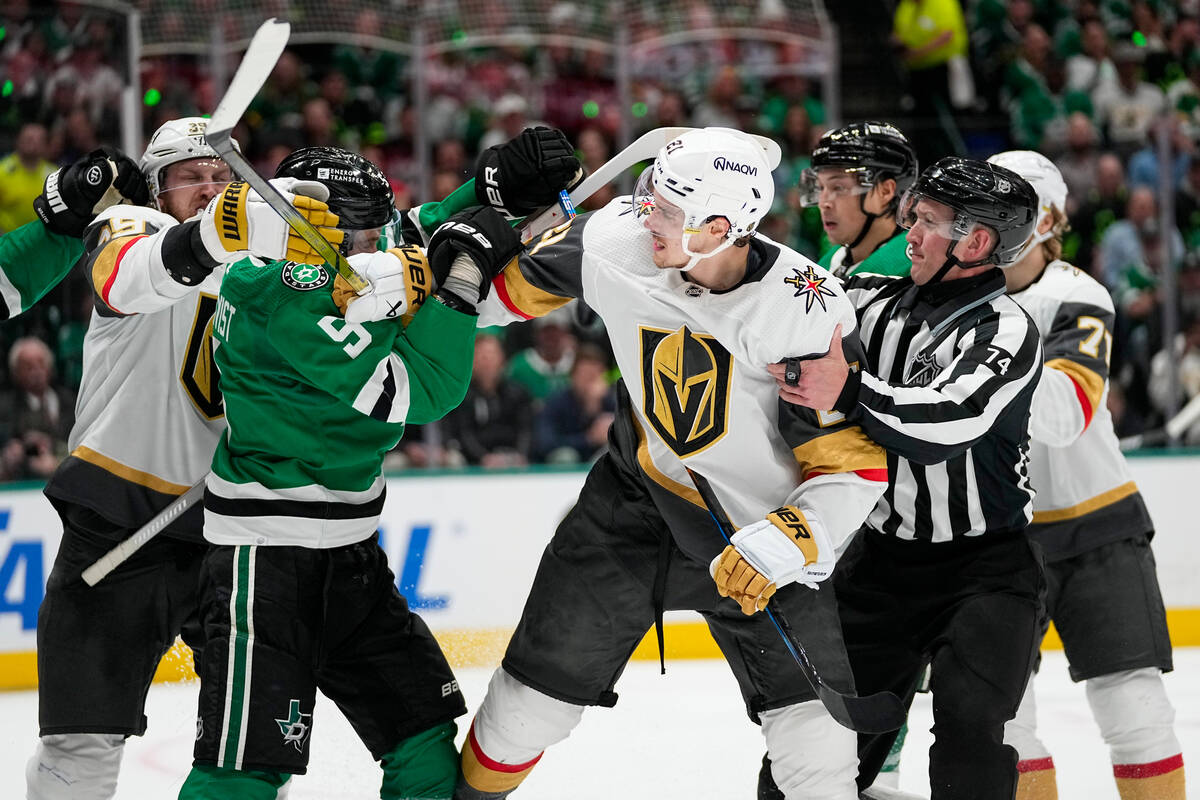NHL linesman Trent Knorr (74) and players try to intervene as Dallas Stars defenseman Nils Lund ...
