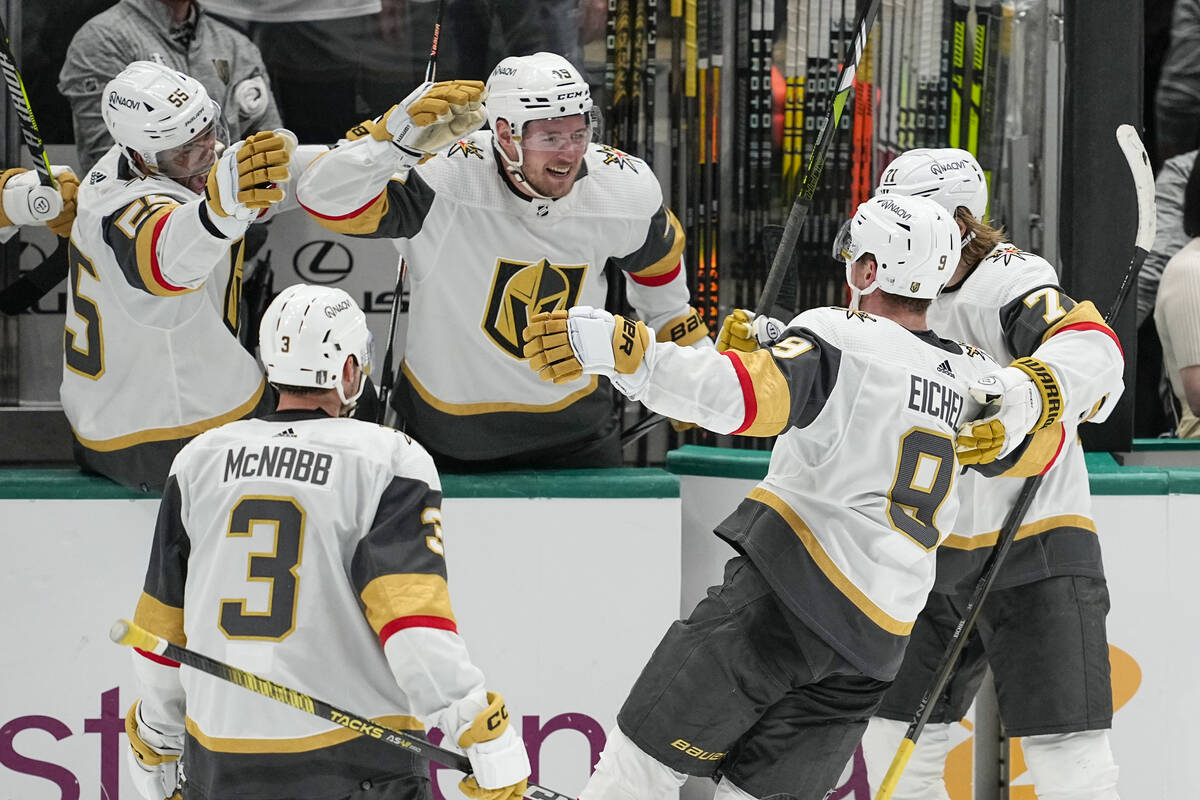 Vegas Golden Knights center Jack Eichel (9) approaches his bench to celebrate his empty net goa ...
