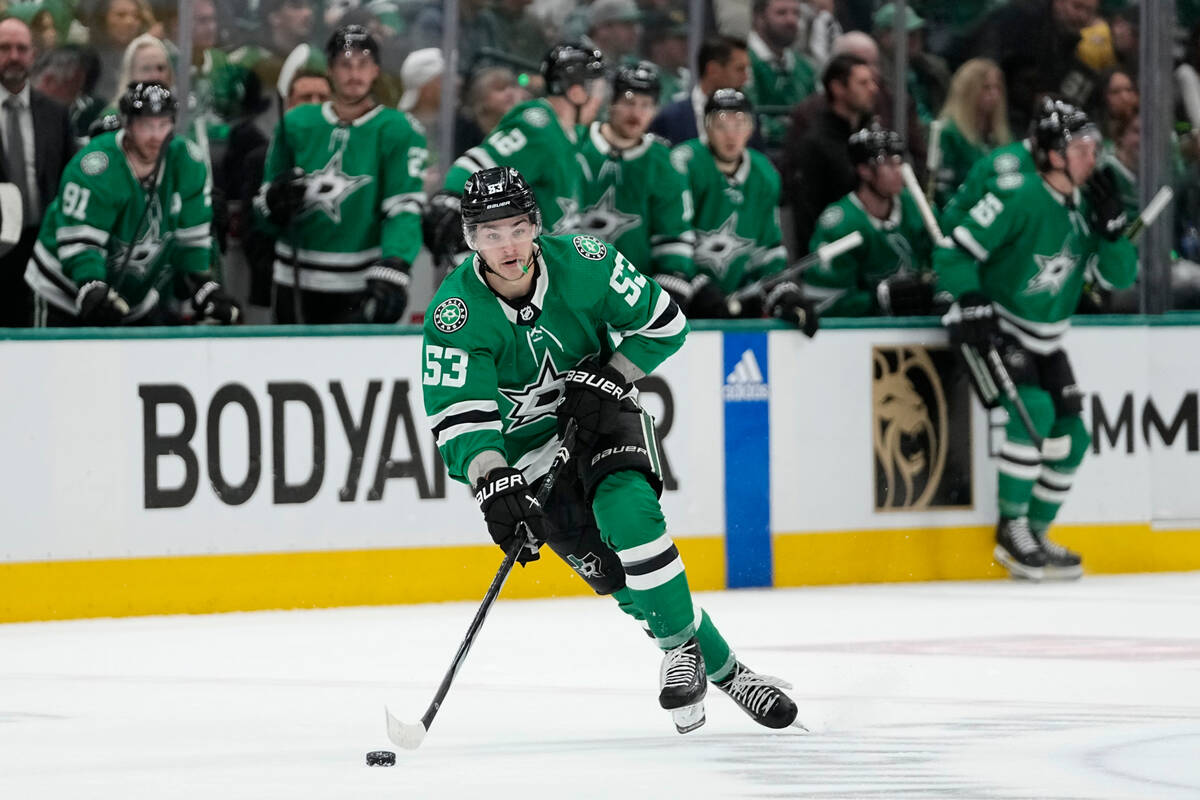 Dallas Stars center Wyatt Johnston skates with the puck against the Vegas Golden Knights during ...