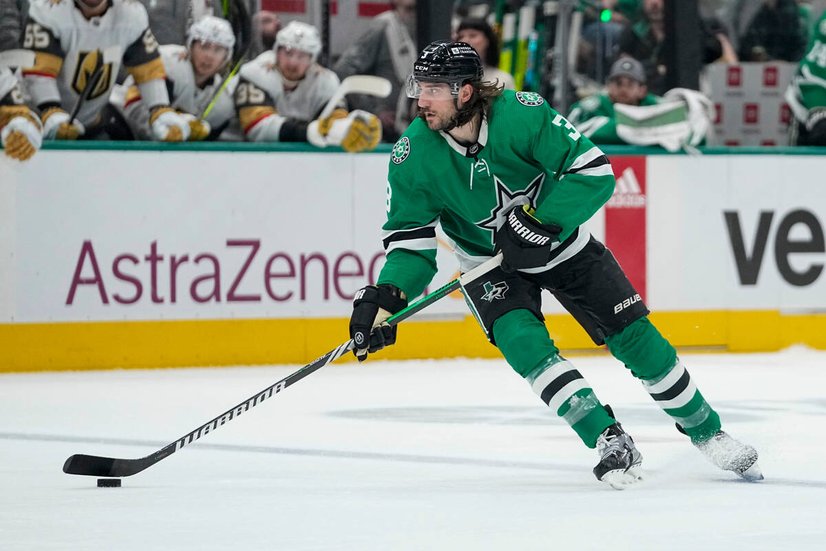 Dallas Stars defenseman Chris Tanev skates with the puck against the Vegas Golden Knights durin ...