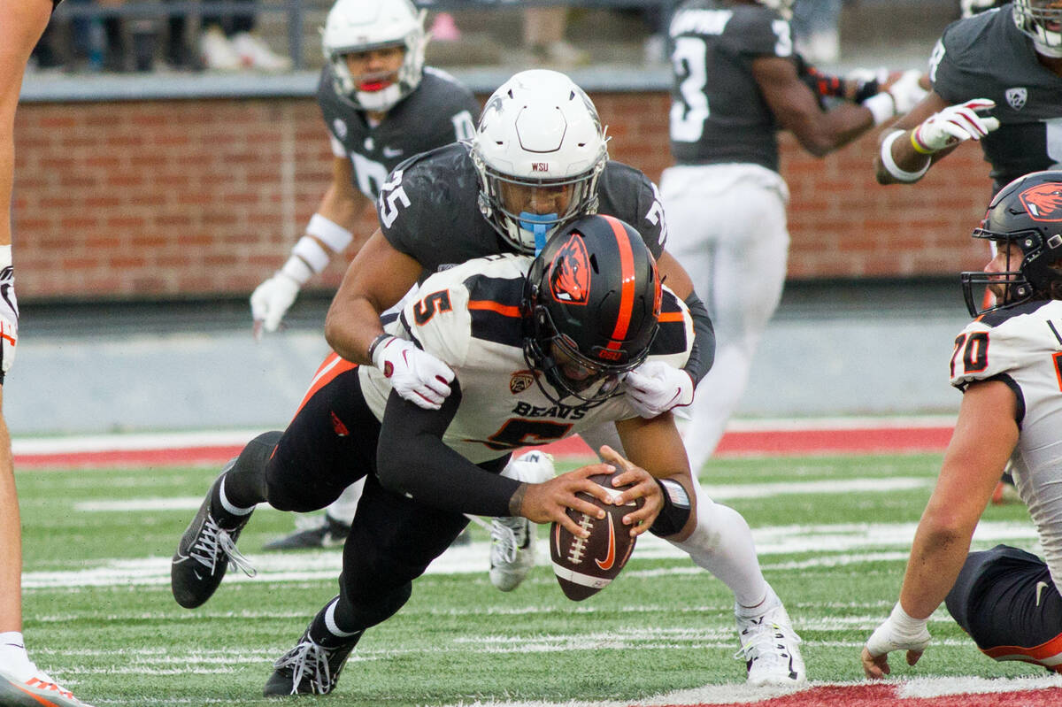 Washington State safety Jaden Hicks makes a tackle while playing the Oregon Beavers at Martin S ...