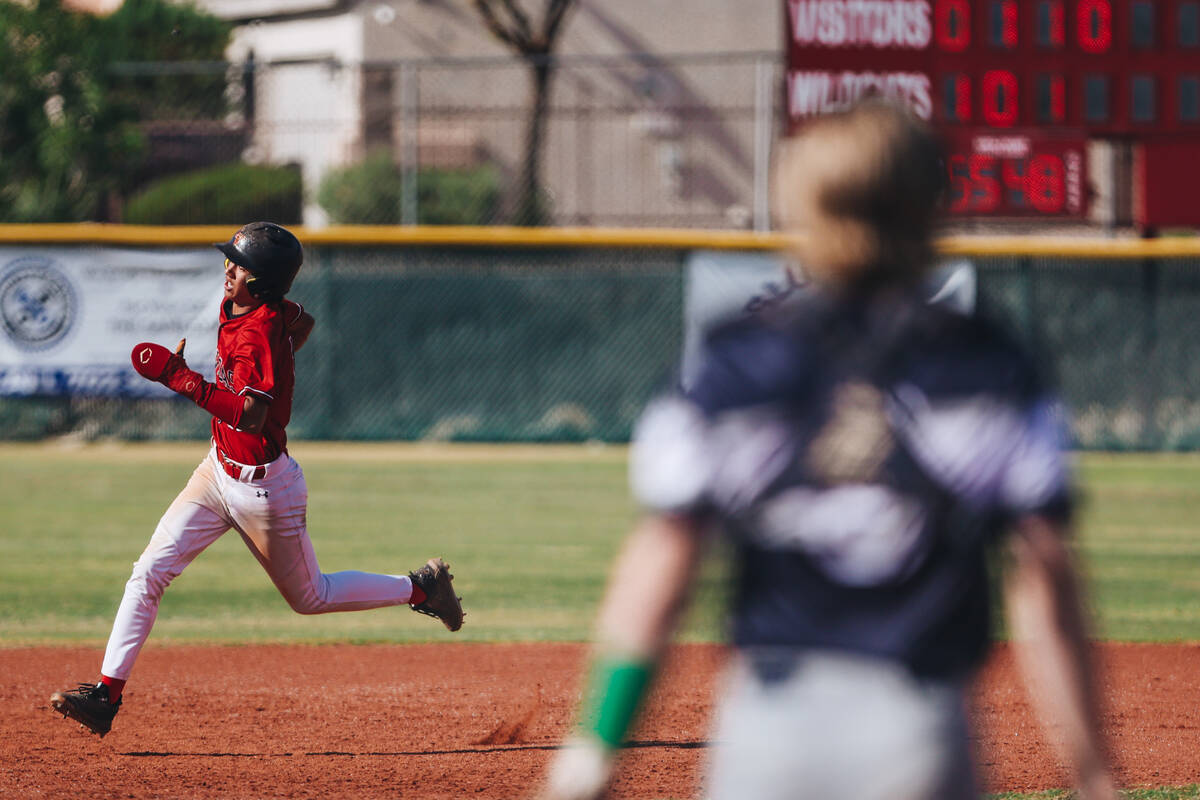Las Vegas’ Adrian Salcido (10) runs to third base during a high school baseball game bet ...