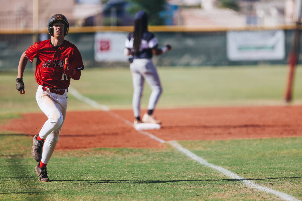 Las Vegas’ Adrian Salcido (10) runs to home base during a high school baseball game betw ...