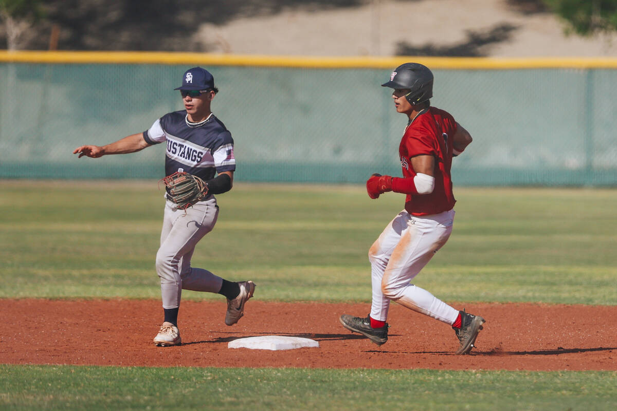 Las Vegas’ Tommy Vibabul (9) makes it to second base during a high school baseball game ...