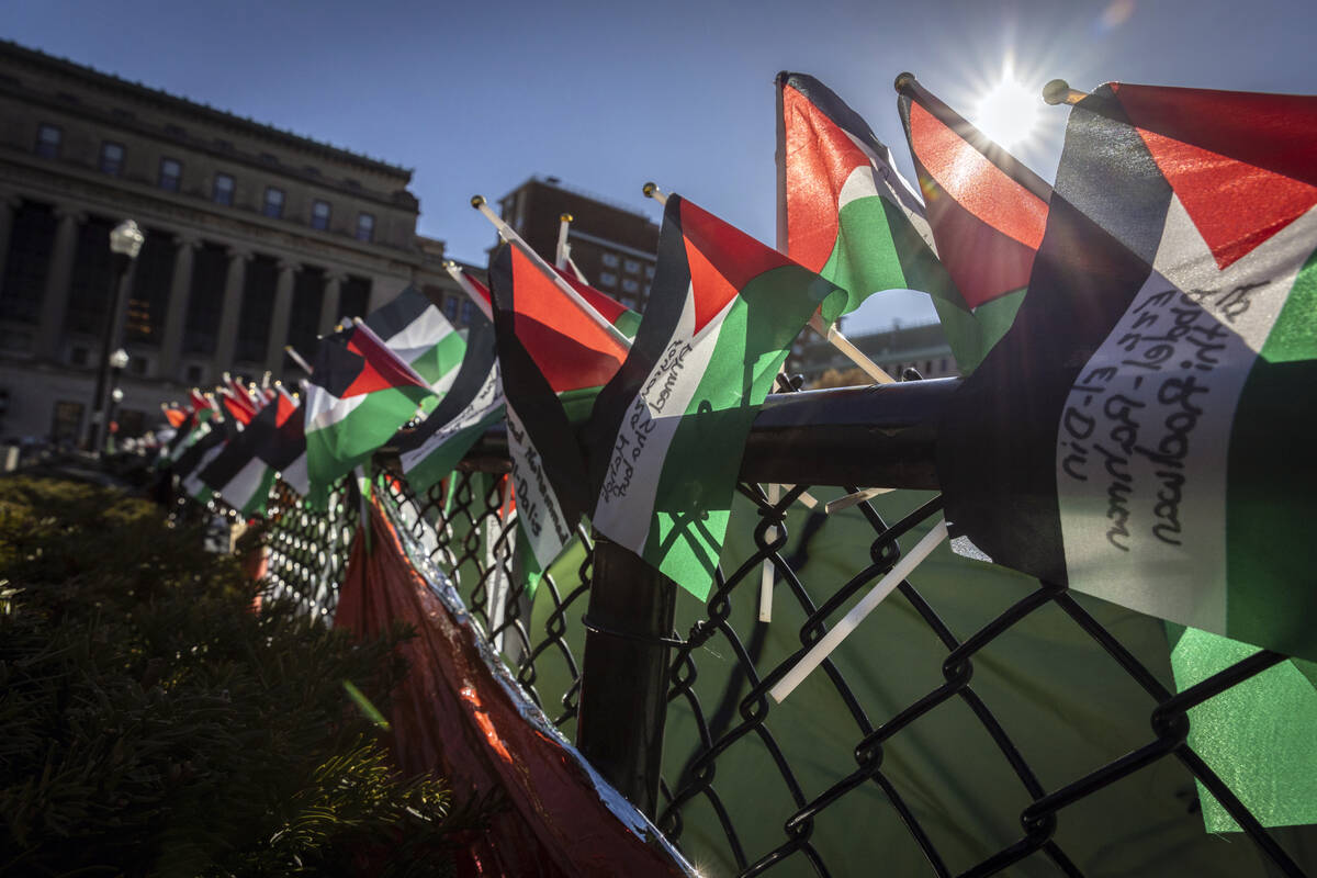 A row of Palestinian flags are seen on the fence at the pro-Palestinians demonstration encampme ...