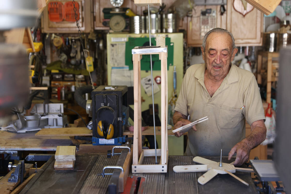World War II veteran Onofrio "No-No" Zicari works in his wood workshop at his home in Las Vegas ...