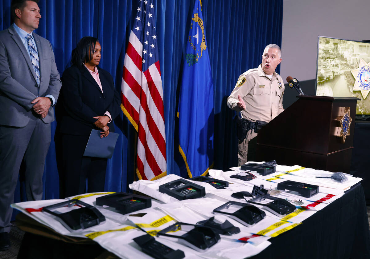 ATM and credit card skimming devices are displayed as Nicholas Farese, LVMPD deputy chief, spea ...