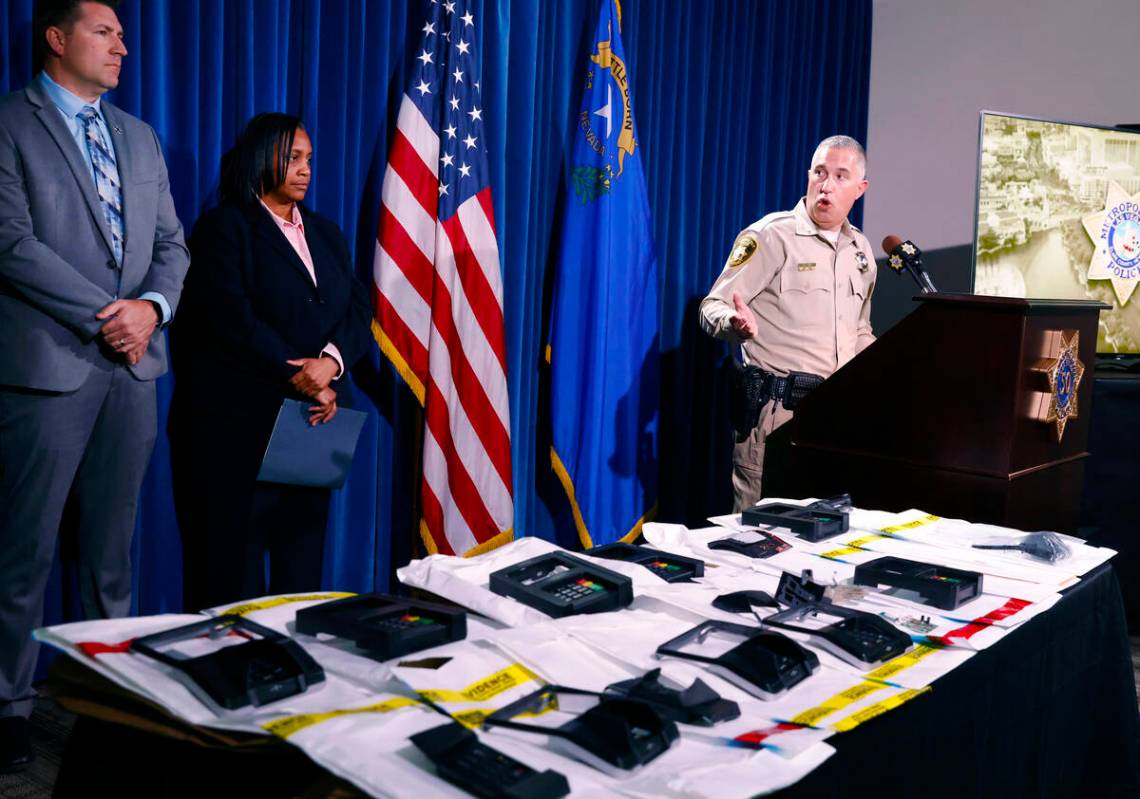 ATM and credit card skimming devices are displayed as Nicholas Farese, LVMPD deputy chief, spea ...