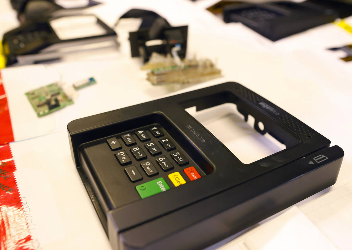 ATM and credit card skimming devices are displayed during a briefing on a operation related to ...