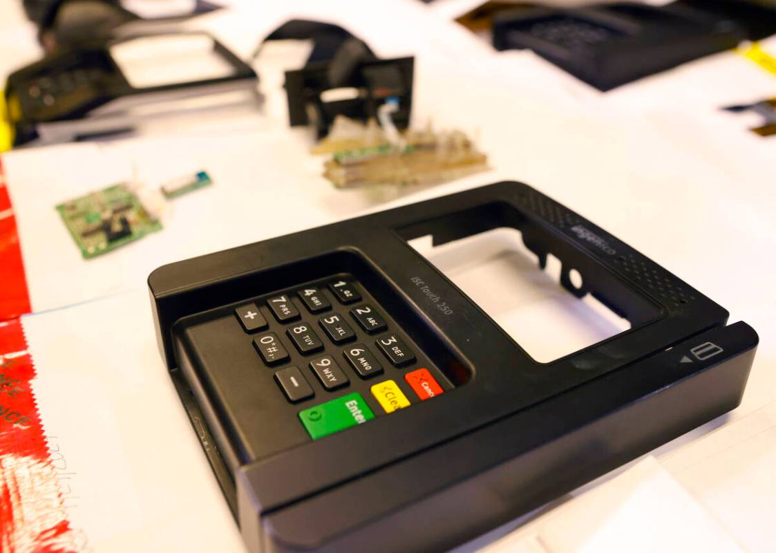 ATM and credit card skimming devices are displayed during a briefing on a operation related to ...
