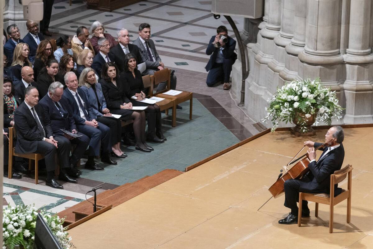 Yo-Yo Ma plays the cello as, front row from left, Second gentleman Doug Emhoff, Deputy Secretar ...
