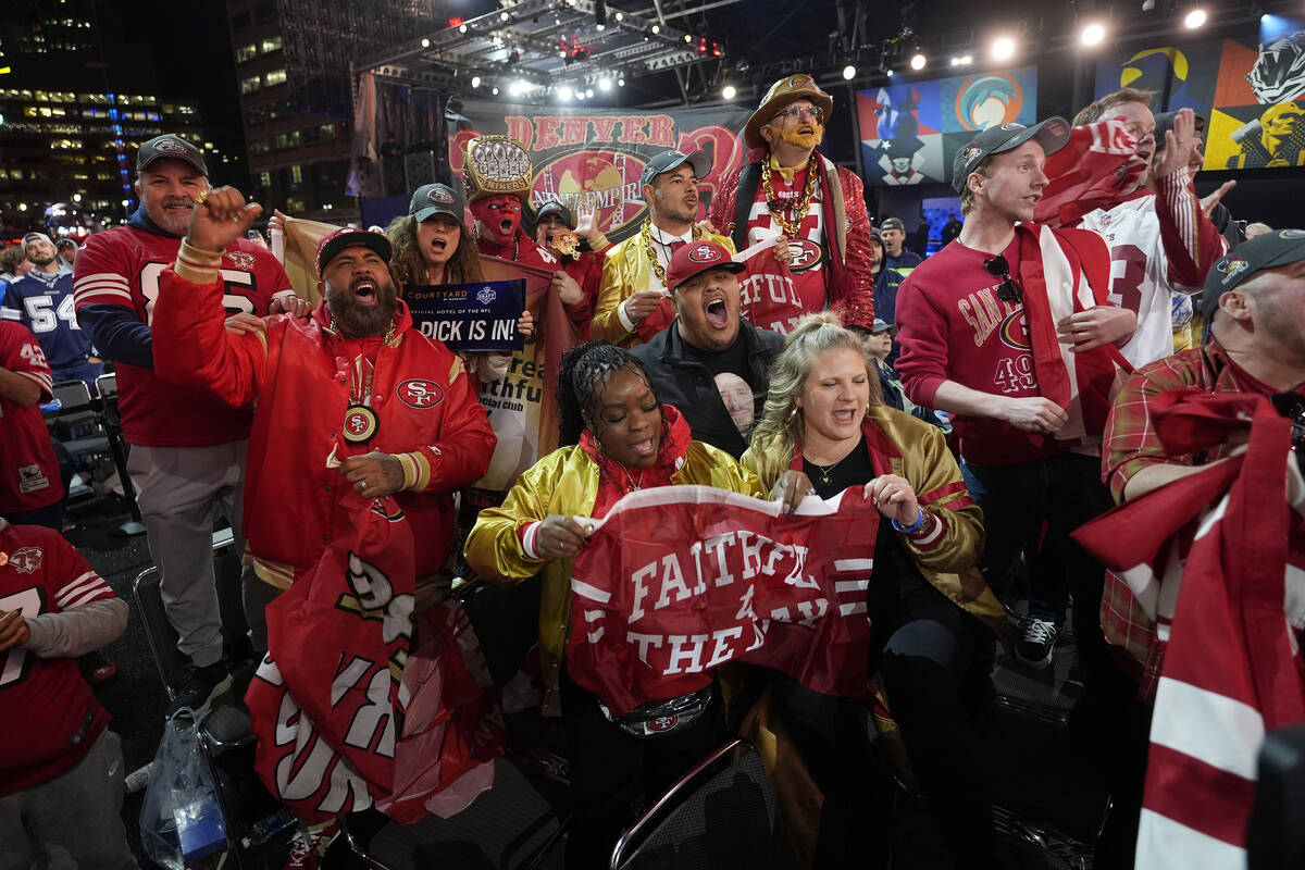 San Francisco 49ers fans cheer during the first round of the NFL football draft, Thursday, Apri ...