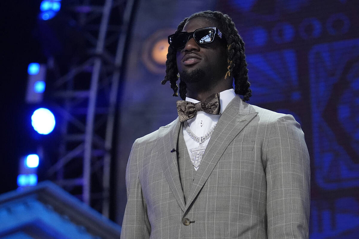 LSU wide receiver Brian Thomas Jr. walks on stage during the first round of the NFL football dr ...