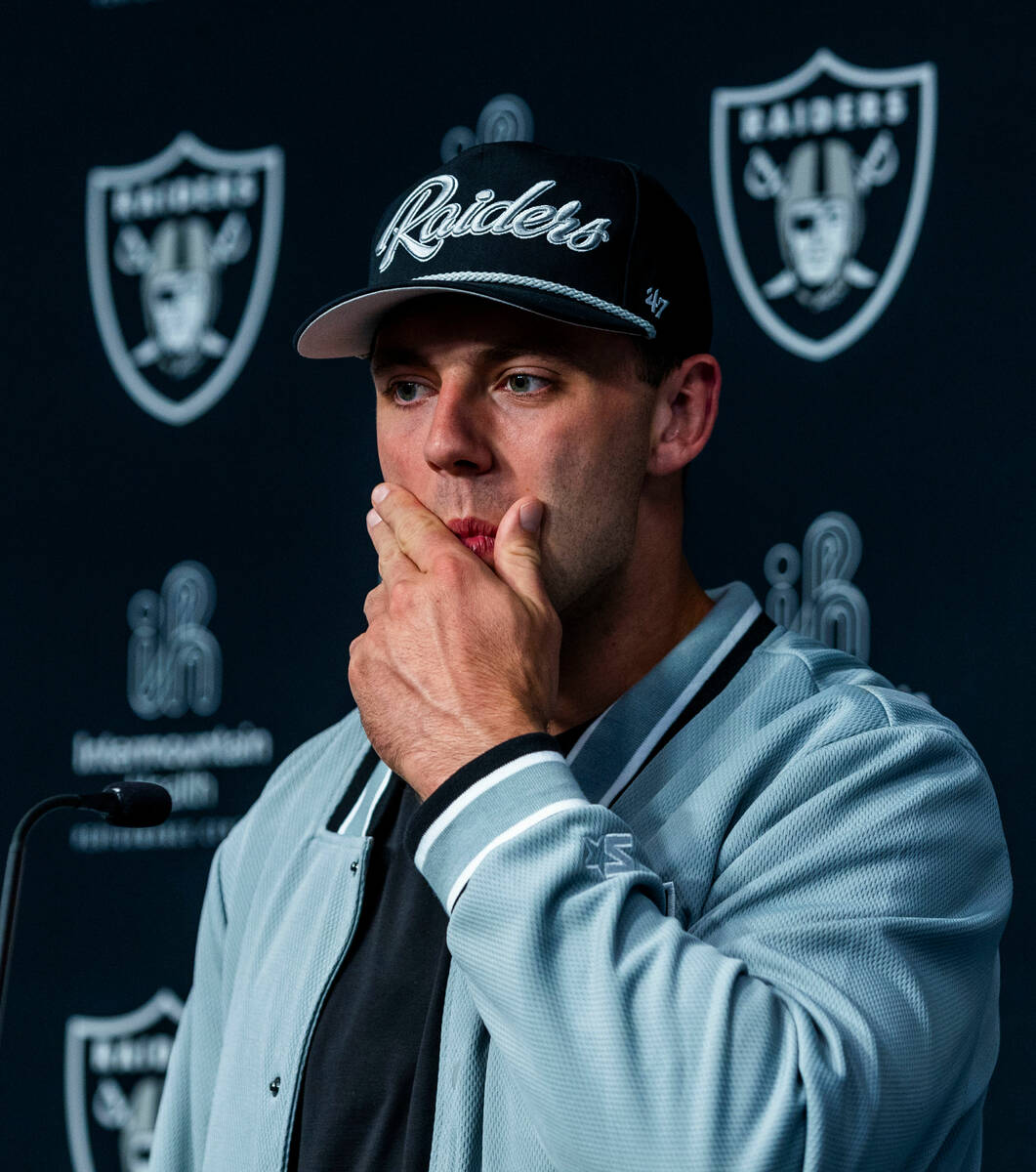Raiders first round draft pick Brock Bowers considers a question as he speaks during a press co ...