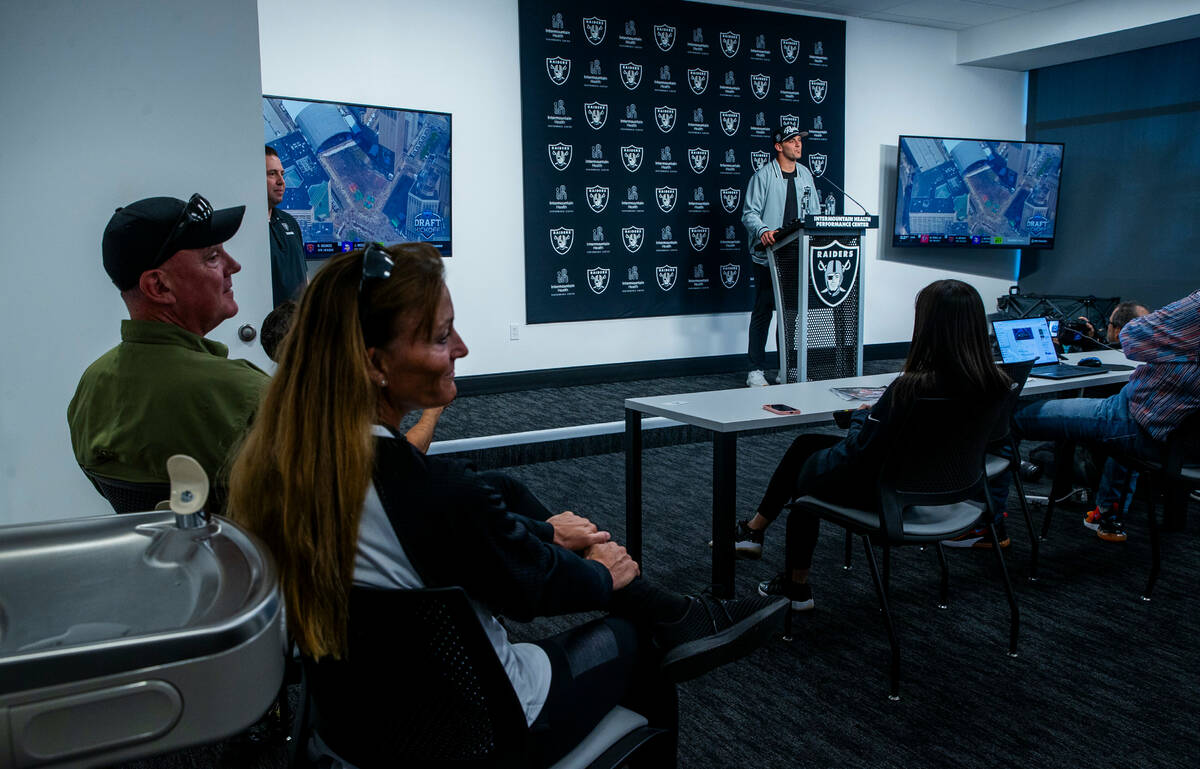 Raiders first round draft pick Brock Bowers speaks as his parents listen in during a press conf ...