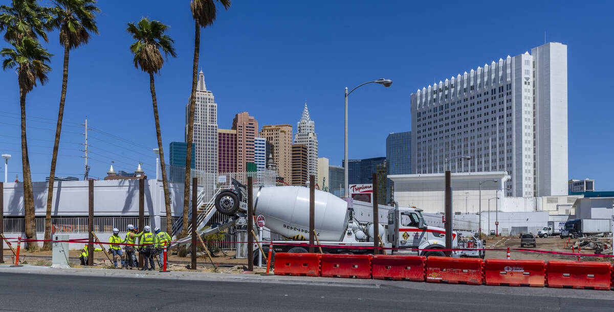 Work continues on the Tropicana hotel-casino as a crew erects a large fence around the property ...