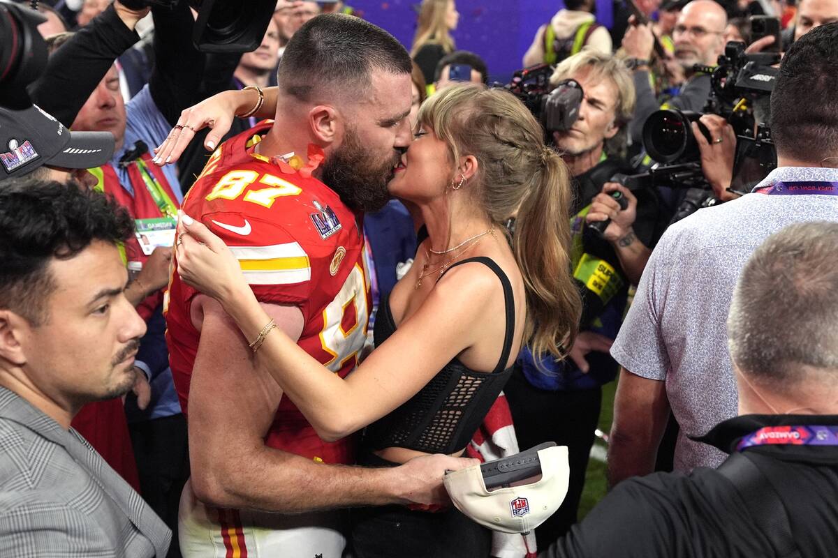 Taylor Swift kisses Kansas City Chiefs tight end Travis Kelce after Super Bowl 58 football game ...