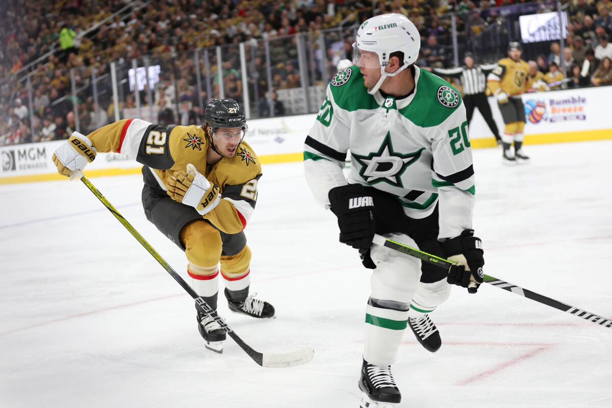 Golden Knights center Brett Howden (21) races after Stars defenseman Ryan Suter (20) during the ...