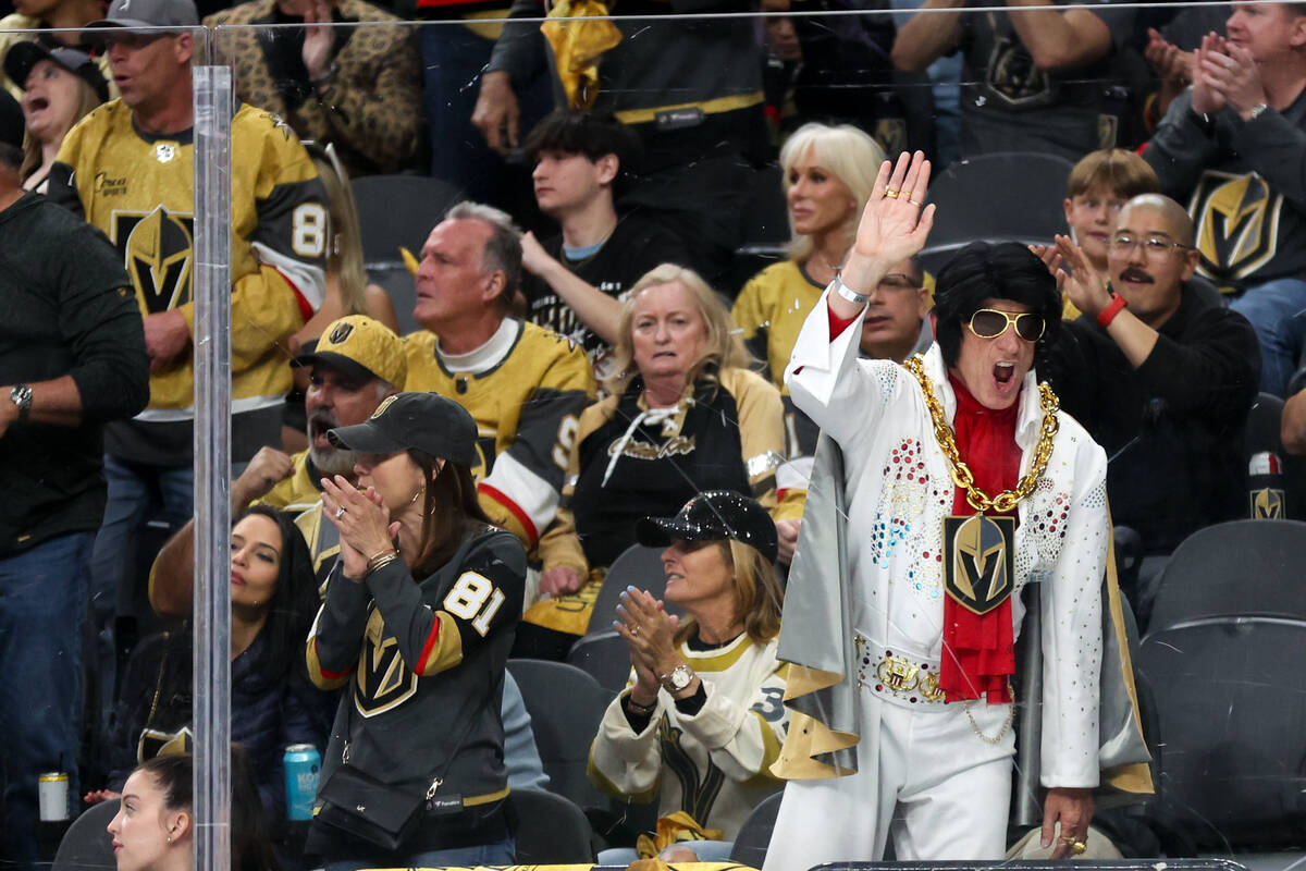 Golden Knights fans cheer after Knights goaltender Logan Thompson made a save during the second ...