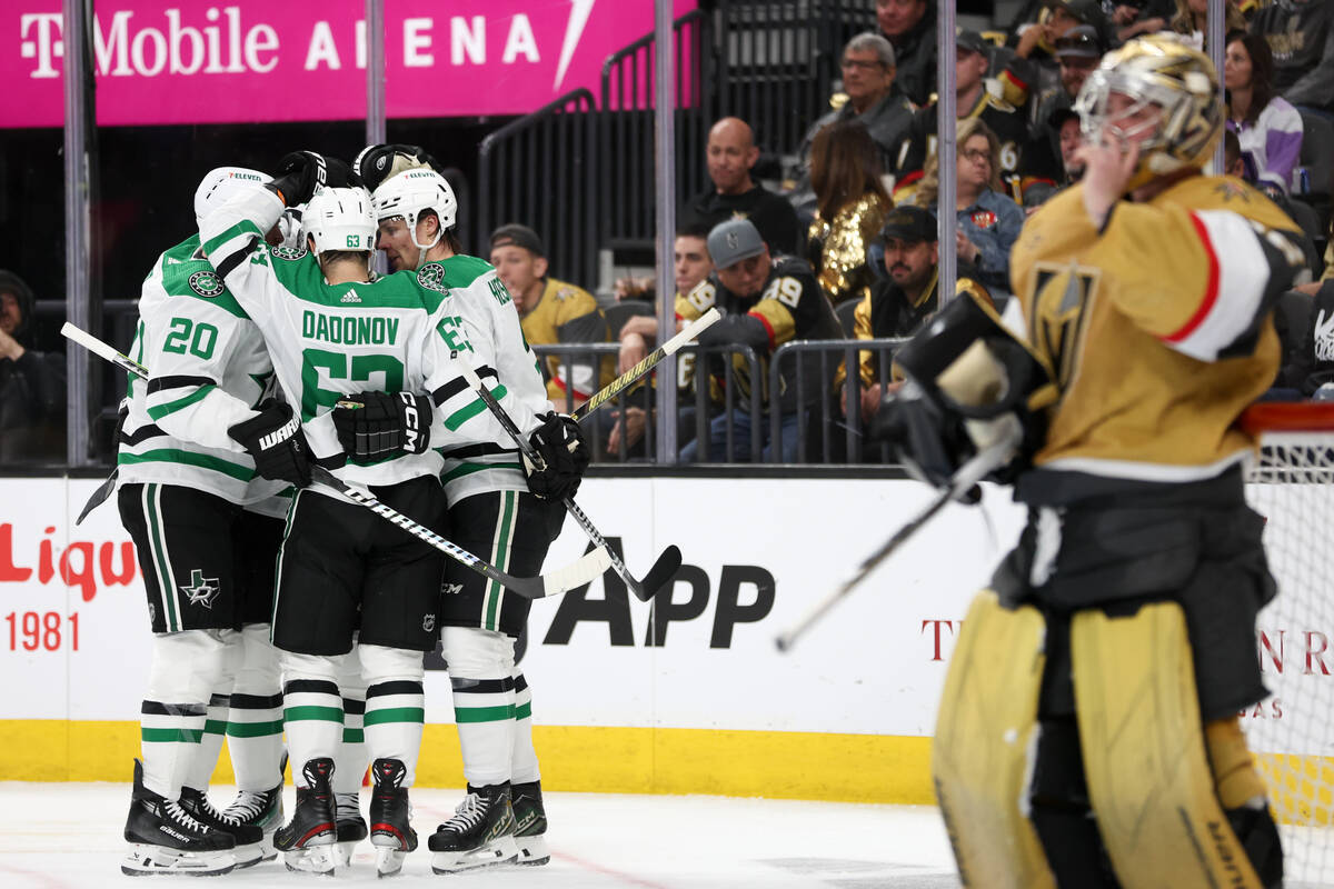 The Stars celebrate a goal while Golden Knights goaltender Logan Thompson (36) reacts during th ...