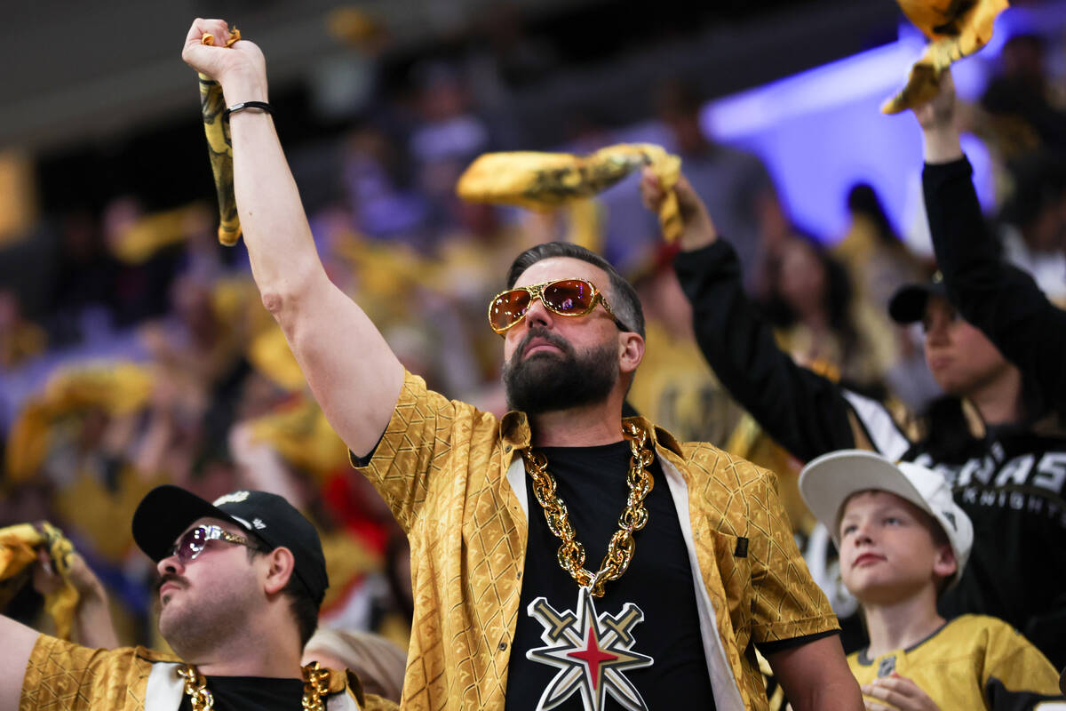 Golden Knights fans wave their towels during the third period in Game 3 of an NHL hockey Stanle ...