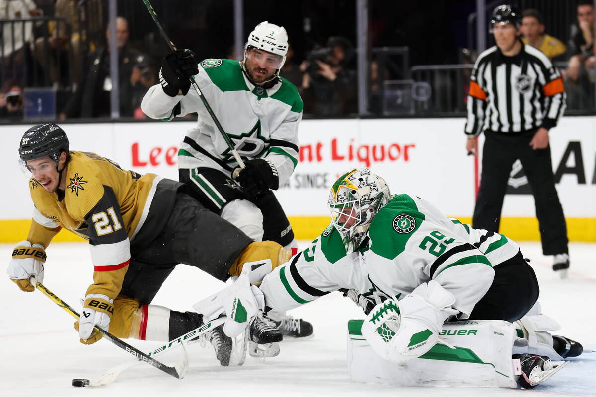 Stars goaltender Jake Oettinger (29) makes a stick save against Golden Knights center Brett How ...