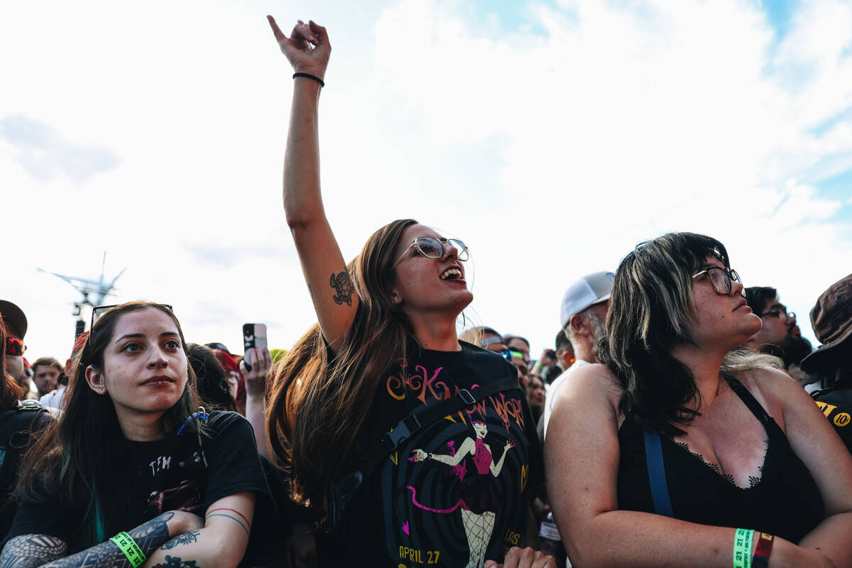 A festival goer dances along to A Perfect Circle during the Sick New World music festival at th ...