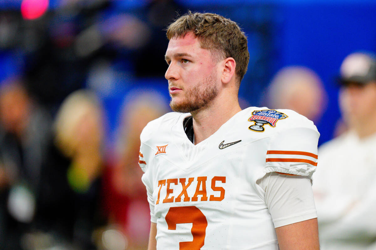 Texas quarterback Quinn Ewers (3) warms up before the Sugar Bowl CFP NCAA semifinal college foo ...