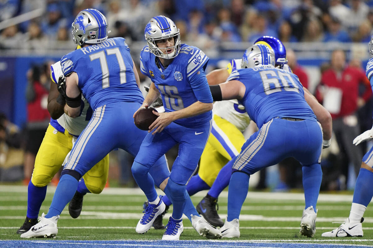 Detroit Lions quarterback Jared Goff (16) looks to handoff during an NFL wild-card football gam ...