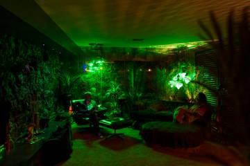 People relax during an evening party at a Beverly Green home called “Lava House” ...