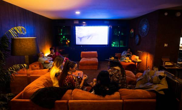 Attendees relax during an evening party at a Beverly Green home called “Lava House&#x201 ...