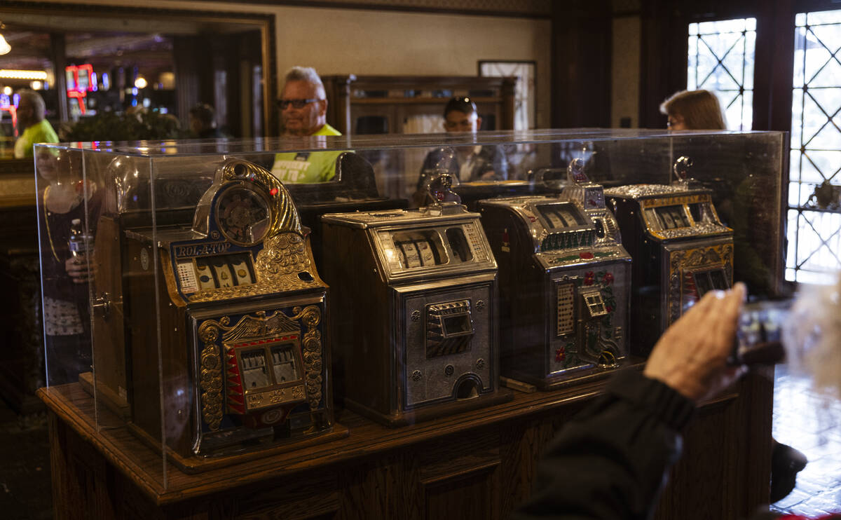 Vintage slot machines are displayed at Main Street Station during a tour of Fremont Street as p ...