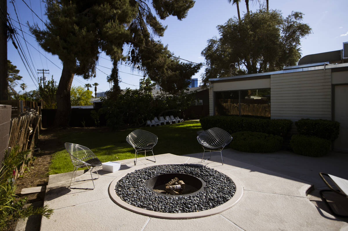 A fire pit near the pool is seen at a 1964 home in the historic John S. Park neighborhood durin ...