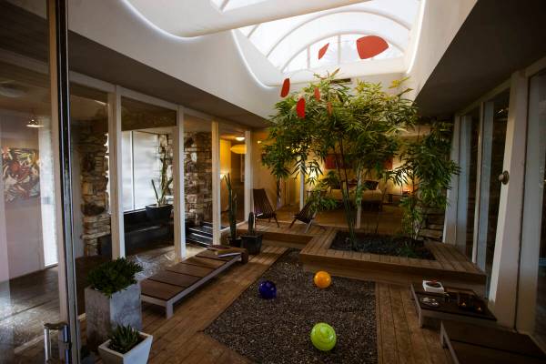 An atrium is seen inside a 1964 home in the historic John S. Park neighborhood during a tour of ...