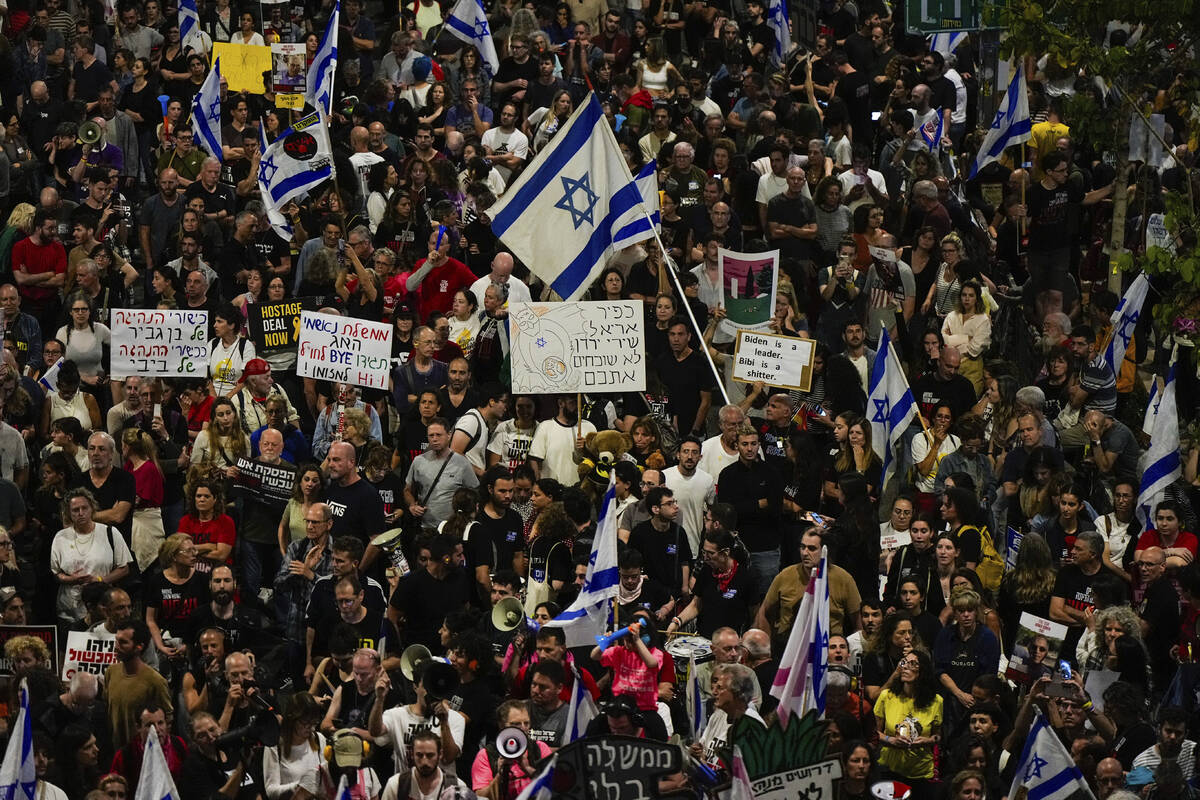 People protest against Israeli Prime Minister Benjamin Netanyahu's government and call for the ...