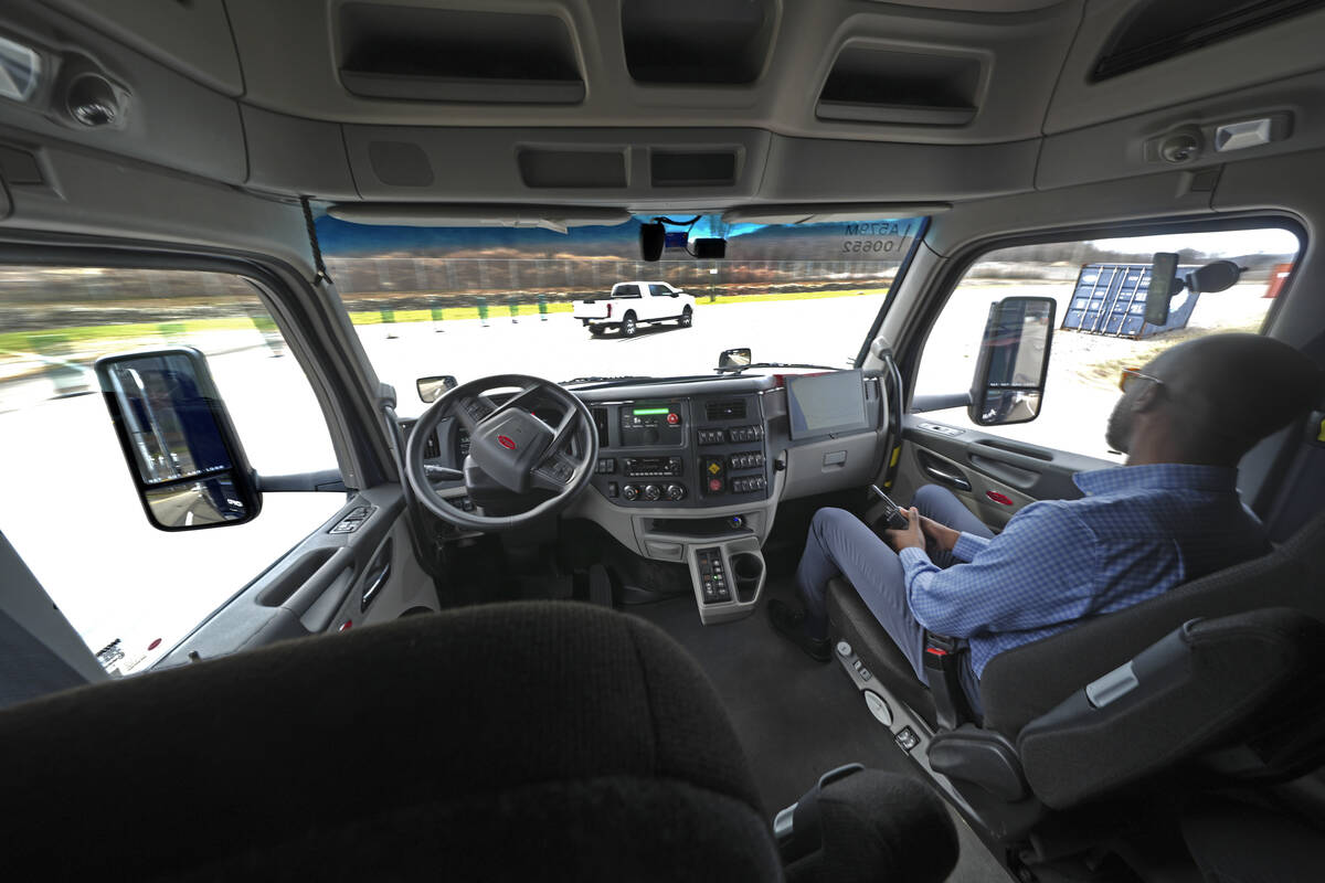The interior of the cab of a self driving truck is shown as the truck maneuvers around a test t ...