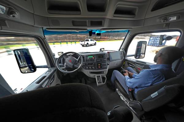 The interior of the cab of a self driving truck is shown as the truck maneuvers around a test t ...