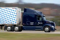 A self-driving tractor trailer maneuvers around a test track in Pittsburgh, Thursday, March 14, ...