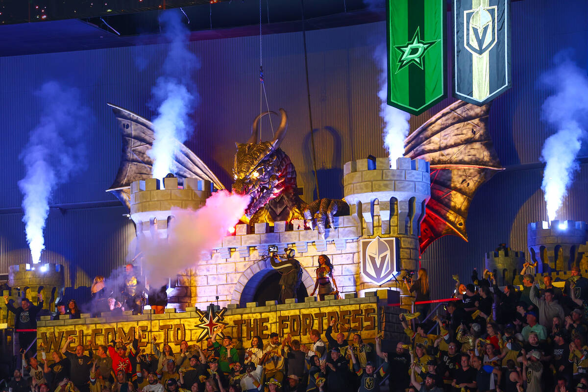 The Golden Knights’ new dragon goes off after the Knights scored during the first period ...
