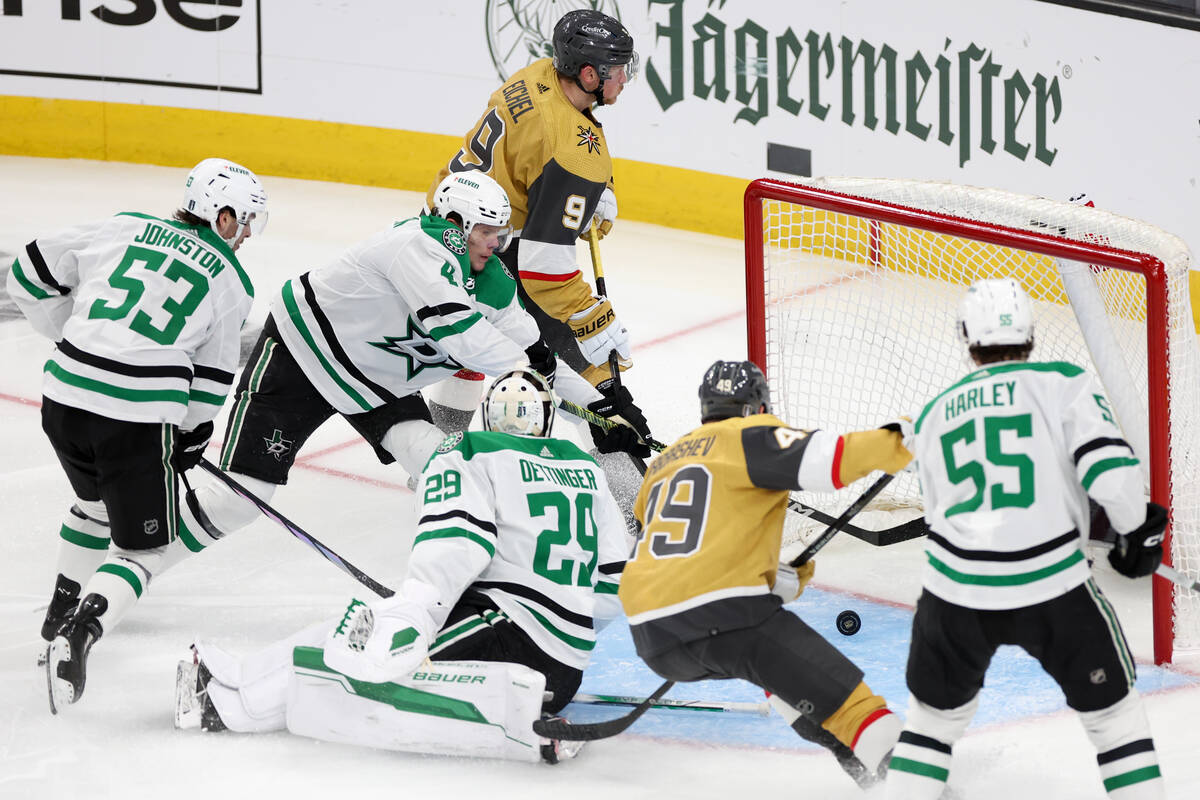 Golden Knights center Jack Eichel (9) scores a goal on Stars goaltender Jake Oettinger (29) dur ...