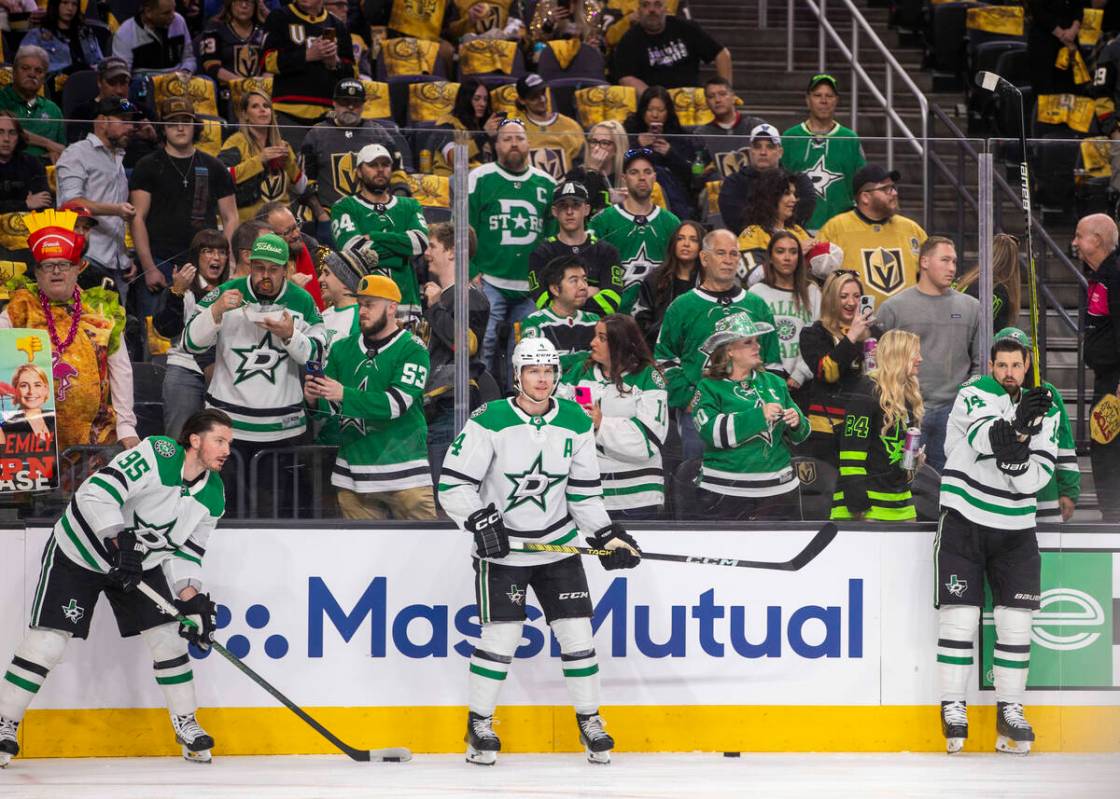 Fans watch as the Dallas Stars get loose during warm ups in Game 4 of their NHL playoff game at ...