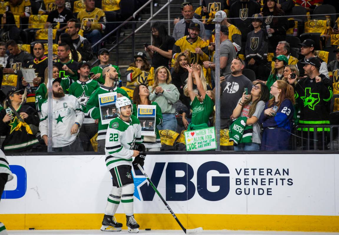 Dallas Stars center Mavrik Bourque (22) looks off after flicking up a puck to toss to the fans ...